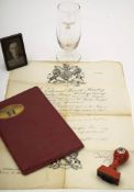 A Third Reich period drinking glass and document holder:,