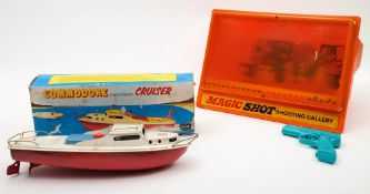 A Commodore Clockwork Cruiser in original box together with a magnetic 'Magic Shot Shooting