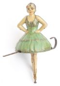 A mid-20th century tinplate ballerina gyroscope:,
