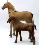 Two late 19th/early 20th century pony skin toy horses:, both with glass eyes,