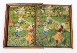 A set of early 20th century jigsaws in a wooden box:, each with polychorme lithograph scene.