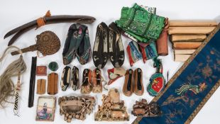 A collection of early 20th century Chinese textiles, shoes,