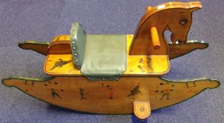 A child's painted wooden slab sided rocking horse: on solid curved shaped rockers,