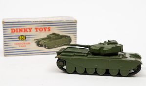 A Dinky Military 651 Centurion Tank:, in green with black rubber tracks and flag decals,