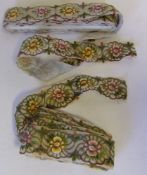 Two lengths of Edwardian floral pattern dress edging: of silk work flowerheads on a gauze backing.