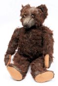 An early 20th century German brown plush Teddy bear:, with glass eyes,