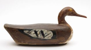 A carved wooden duck decoy:, hand finished with lead weight to underside, 43cm long.