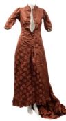 A late 19th/early 20th century floral embroidered silk dress:, with short mandarin collar,