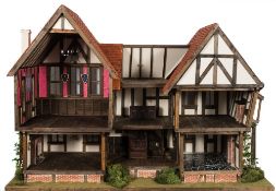A bespoke dolls house by Connor and Cameron Dollhouses in the Tudor-style: with exposed beams,