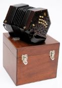 A rosewood and ivory 24 button Anglo concertina by Lachnel & Co:,