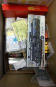 A collection of assorted model railway accessories: including decals, kits, wheels,