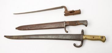 A Mauser pattern bayonet, a St Etienne bayonet and a socket bayonet:(3).