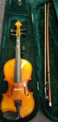 A modern student three quarter size violin: the two piece back of medium flame and curl,