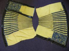 Two sections (one in two parts) of a late 19th century Chinese Imperial silk skirt: with floral