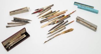A collection of silver and silver plated propelling pencils, pencil holders and dipping pens:,