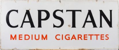 An enamel advertising sign for Capstan Medium cigarettes: red on white - 46cm x 110cm.