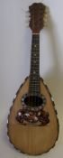 An Italian rosewood and tortoiseshell inlaid mandolin: with mother of pearl strung border,