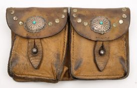 A Western style leather double ammunition pouch:, with pressed oval applique and studded decoration,