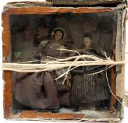 A pair of Victorian wooden head dolls in a glazed case:,