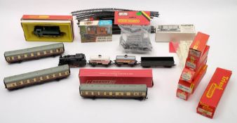 A collection of Hornby and Tri-ang railway:, including an 0-6-0 BR tank locomotive,