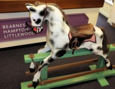 A 20th century rocking horse:, with black and white mane and tail,