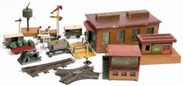 A wooden double tack engine shed, a wooden platform with waiting room and ticket office,