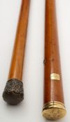 A Georgian yellow metal mounted walking cane together with a similar later silver mounted example:,