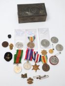 A collection of various medals, medallions, badges and commemorative coins etc:,