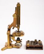 A brass monocular microscope by R & J Beck, London:, number 17009,