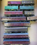 A collection of various scratchbuilt passenger coaches and rolling stock:, various liveries.
