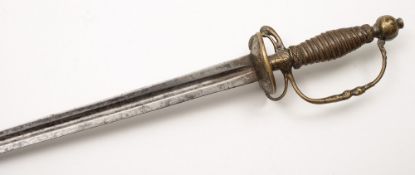 An 18th century boy's short sword: the tri-form blade over double shell hilt with decoration of