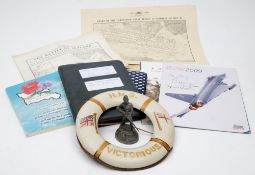 A collection of various military ephemera and collectables including an HMS Victorious life