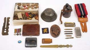 A collection of various regimental buttons and badges,