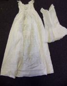 An early 20th century white work Christening gown: and petticoat.