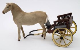 A late 19th/early 20th century pony skin toy horse and later wooden model of a dog cart:,
