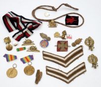 A collection of various military buttons and badges together with two WWI Victory medals:,