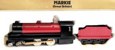 A Markie O gauge 4-4-0 live steam locomotive and tender:, in black and red livery in original box.