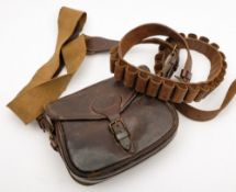 A leather cartridge bag and a leather twelve bore cartridge belt:.