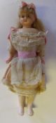 A late 19th / early 20th century French wax doll: with fair mohair wig, fixed blue eyes,