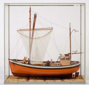 A scale model of the fishing trawler 'Phyllis':, fully rigged with hanging nets ,