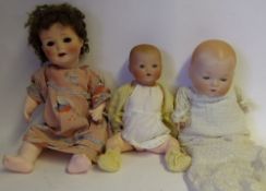 An Armand Marseille bisque head doll: impressed AM. Germany. 351/2K.