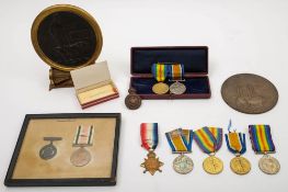 Two WWI memorial plaques:, one with a trio of medals to '3793 Pte K R Graham 16 Lond R',