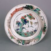 A Chinese porcelain famille verte plate: the centre enamelled with geese amongst peony,
