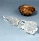 A Chinese stone circular box and cover and a Tibetan quartz crystal Phurba: the base of the box