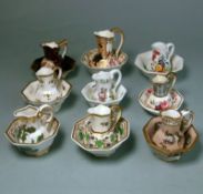Nine English porcelain miniature jug and basin sets: the bowls of octagonal form with matching jugs
