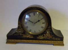 A chinoiserie decorated mantel clock: of arched outline,