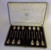 A set of twelve Edward VII seal top coffee spoons and tongs, maker David Fullerton,