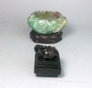 A Chinese black hardstone seal and a fluorspar bowl: the seal of stepped square form surmounted