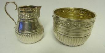 An Edward VII silver cream jug and sugar basin, maker Charles Stuart Harris, London,