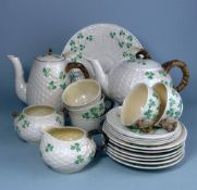 A Belleek Shamrock pattern part tea service: comprising teapot and cover, hot water jug and cover,